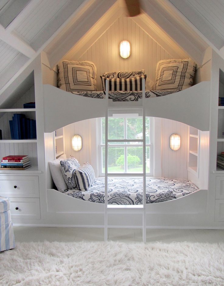 there is a bunk bed built into the ceiling in this room with white carpeting