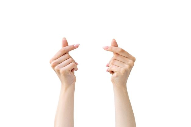 two hands holding something up in the air with one hand raised above the other, on a white background