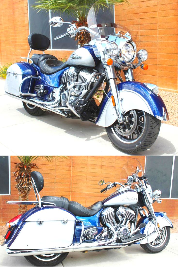 two motorcycles parked next to each other in front of a brick wall and palm tree