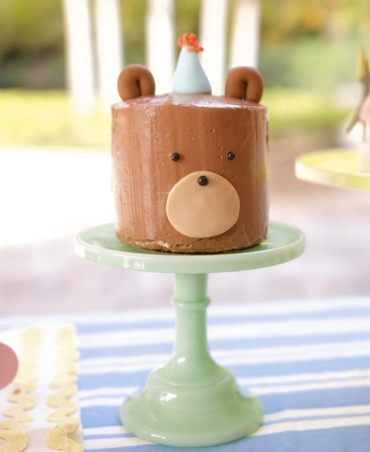 a birthday cake with a bear face on it