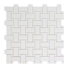 a white tile wall with squares in the middle and one square at the bottom, on top