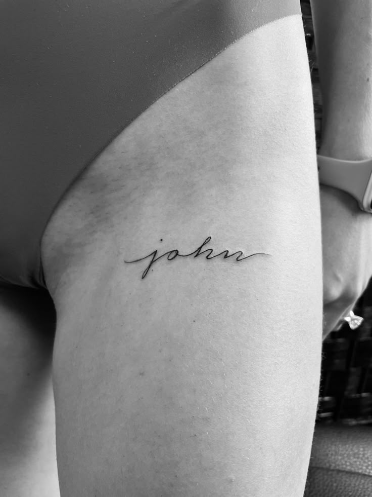 a woman's thigh with the word jokin written in cursive font