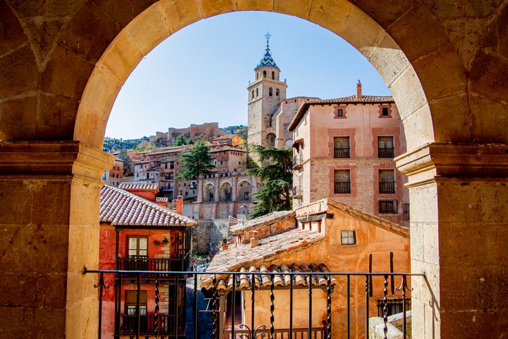 an arched doorway leads into the old city