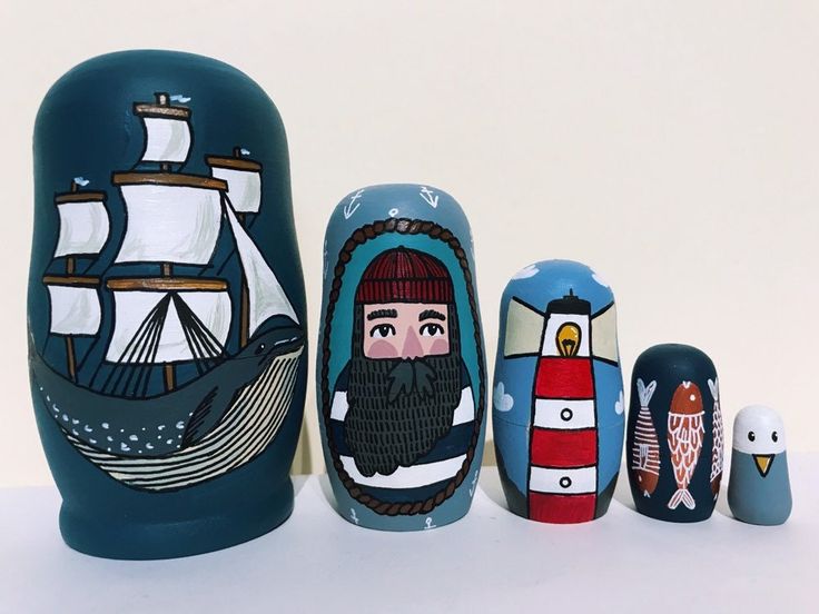 three nesting dolls are sitting next to each other