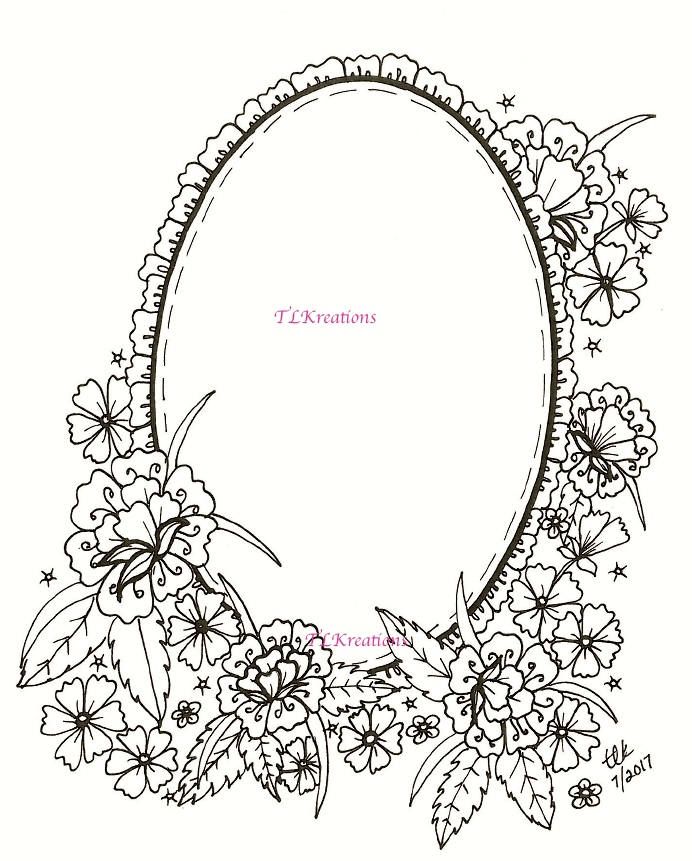 an oval frame with flowers and leaves around it, drawn in black ink on white paper