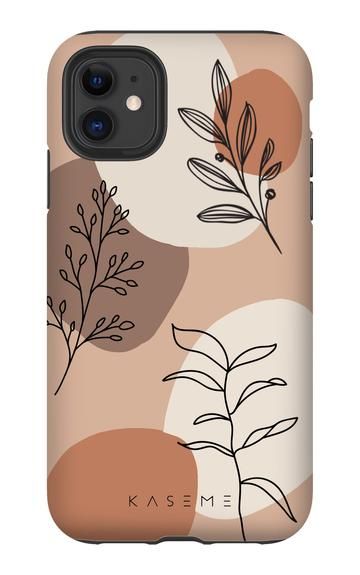 a phone case with leaves and circles on the back in pink, brown, orange and white