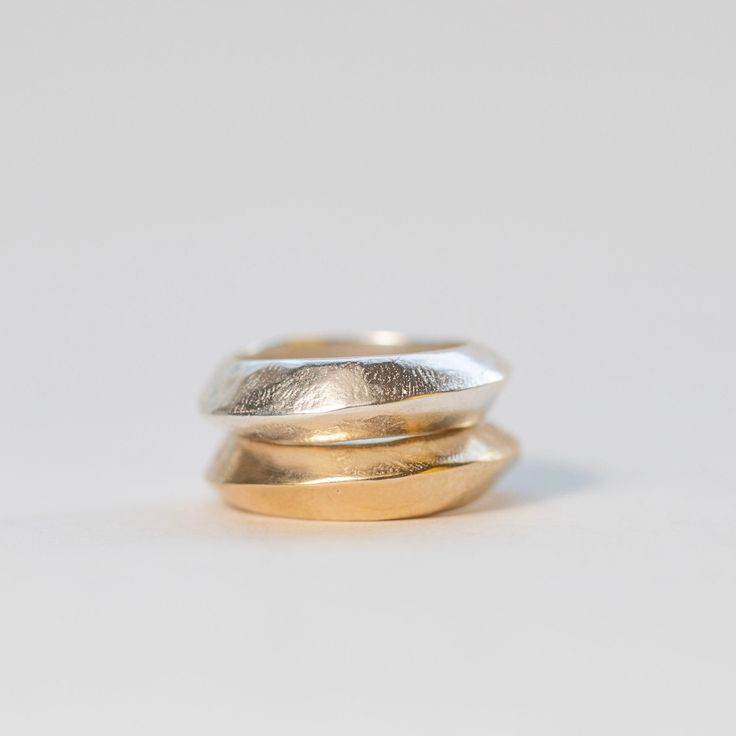 Mixed metals knife edge bands. The edge design goes from high to low as it moves around the ring. original design carved in wax and cast 5mm wide, width varies slightly around the band Stack is two rings cast in silver: and one ring is vermeil and one is silver Silver Metal Ring With Thick Band, Chunky Mixed Metal Rings, Organic Silver Ring, Modern Irregular Metal Rings, Irregular Gold Metal Rings, Sitewide Sale, Edge Design, Silver Rings Handmade, One Ring