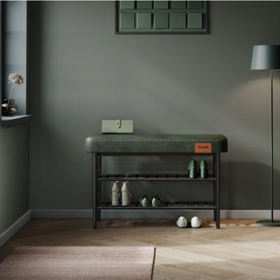 a living room with grey walls and wooden flooring is pictured in this image, there are two lamps on either side of the table