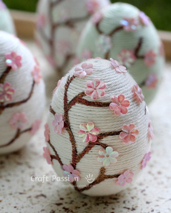 some white balls with pink flowers painted on them