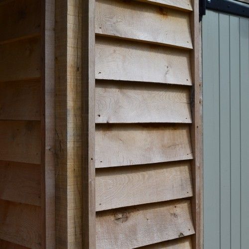 the side of a building with wooden slats