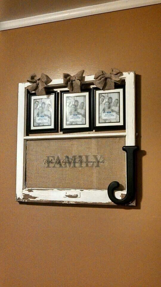 an old window frame with family pictures on it and the word's name underneath