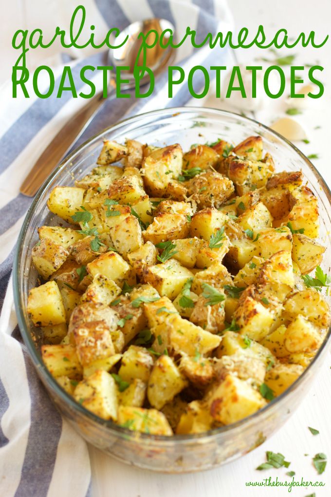 garlic and parmesan roasted potatoes in a glass bowl on a striped towel with text overlay