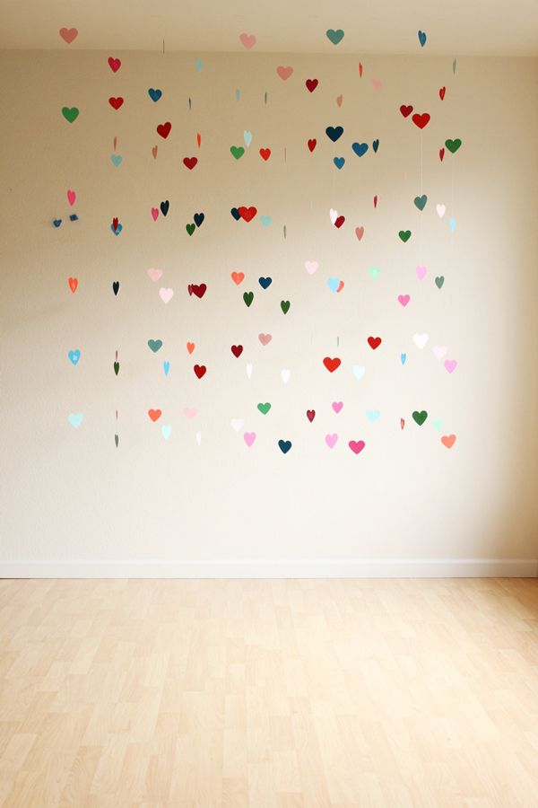 an empty room with hearts on the wall