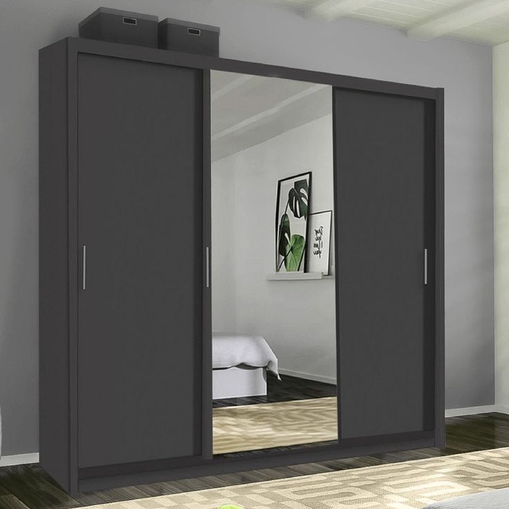 an image of a bedroom setting with mirrored closet doors