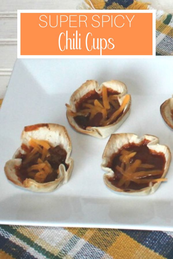 four small appetizers on a white plate with text overlay that reads super spicy chili cups