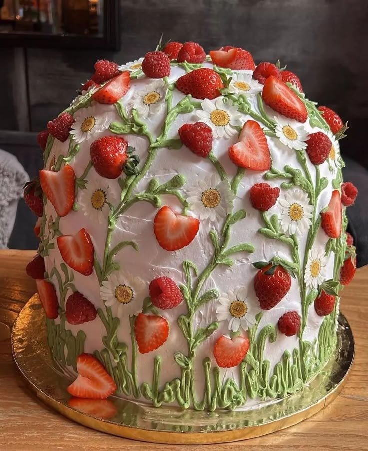 a decorated cake sitting on top of a wooden table