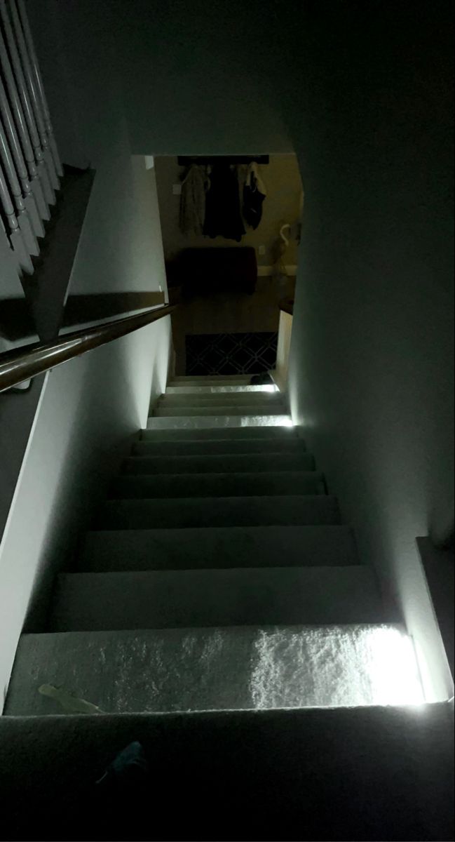 the stairs are lit up with light coming from them