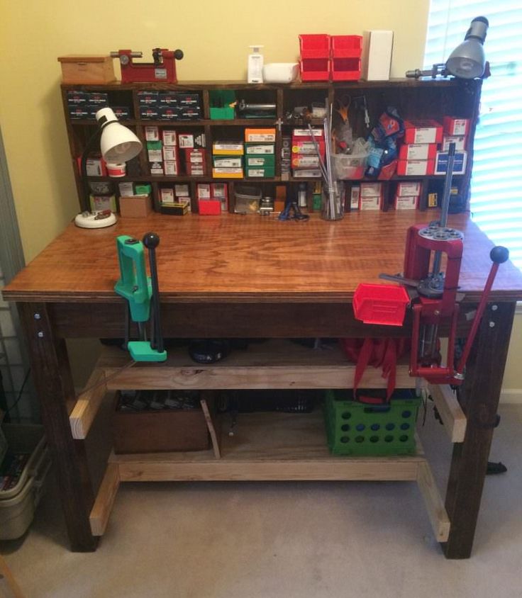 a workbench with tools and other items on it in a home office area