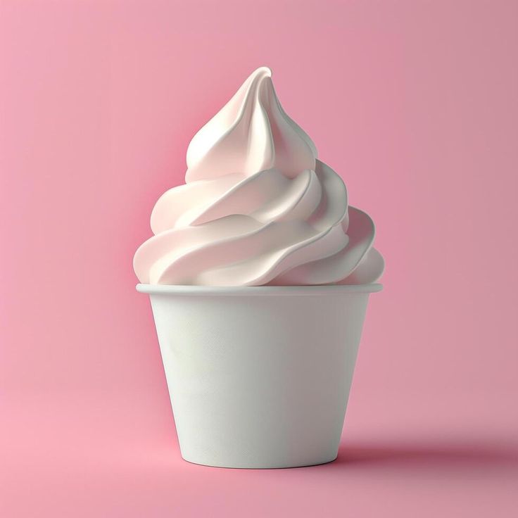 a white cup filled with whipped cream on a pink background