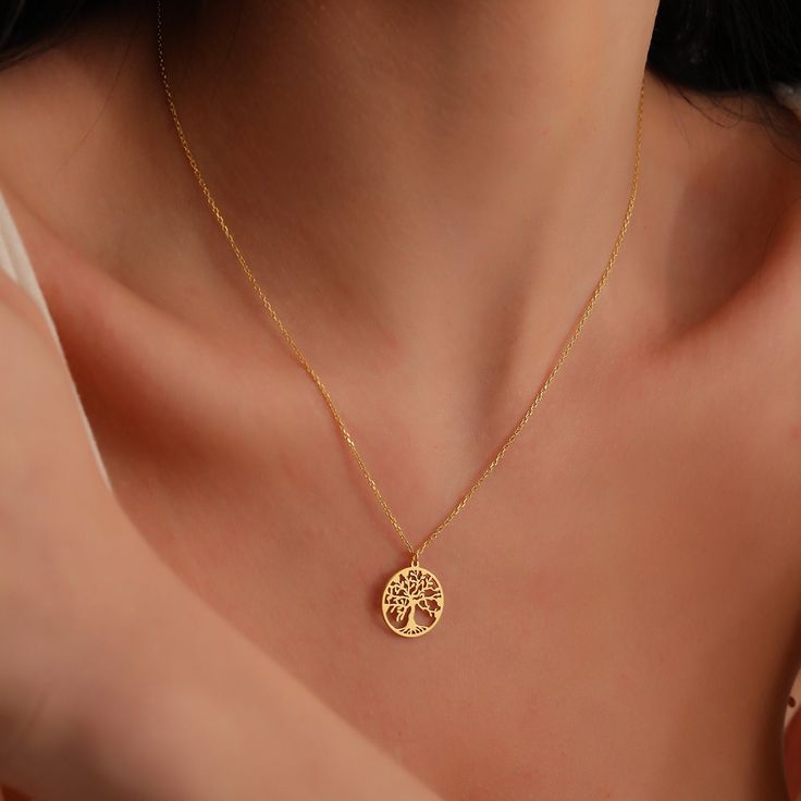 "This 14K Solid Gold Life Of Tree Family Tree Necklace would be the perfect Mother's day gift for your mother. There are several interpretations of the tree of life as the meaning has grown with the tree over time. Often, the tree of life is a symbol of growth and new beginnings without losing your past and roots. The tree branches out and grows strong but only because the roots are deep. This minimalist personalized piece is a perfect Christmas gift to share your love and be memorable for years. Minimalist, custom, dainty, special to you... ♡ TREE OF LIFE NECKLACE ✣ * Made to Order * Pendant Size: 15mm * Material Options:  14K Solid Gold,  High Quality 925k Sterling Silver  * Color Options:  Yellow Gold,  Rose Gold,  White Gold * Production Techniques:  Handmade  - Laser Cutting to have H Tree Of Life Pendant Gold, Tree Of Life Necklace Gold, Chain For Women Neck, Gold Pendant Designs For Women, Gold Tree Of Life, Tree Family, Necklace Tree, Pendant Minimalist, Easter Jewelry