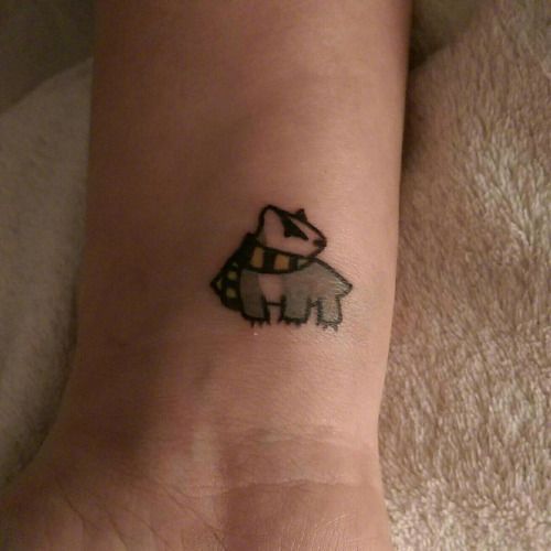 a small tattoo on the wrist of a person