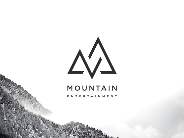 the mountains are covered in snow and there is a black and white logo on it