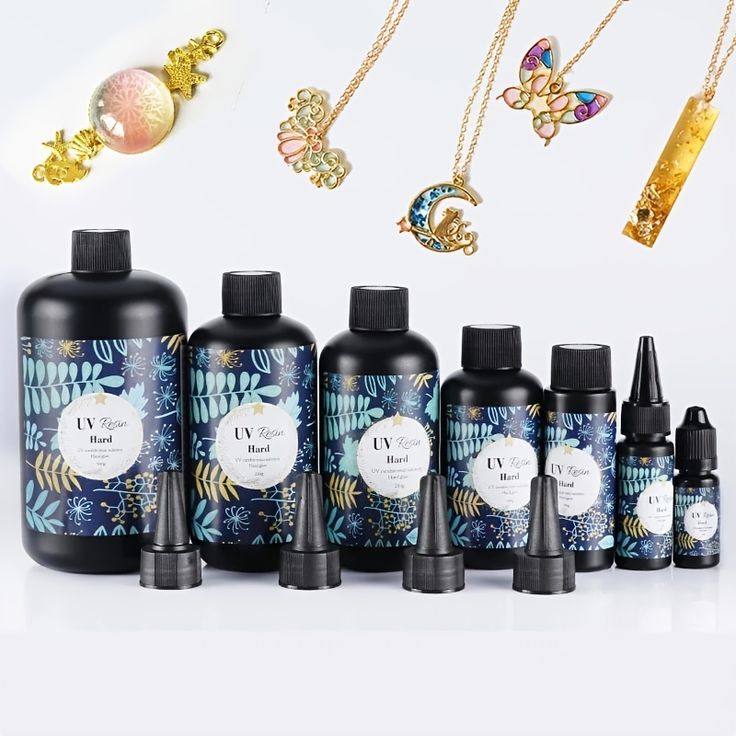 an assortment of bottles and necklaces on a white background with space in the sky