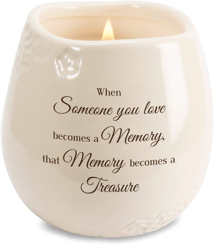 a white ceramic candle holder with the words, when someone you love becomes memory that memory becomes