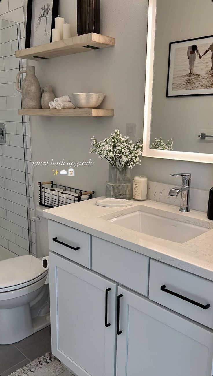 a bathroom with a sink, toilet and shower in it's center area is shown