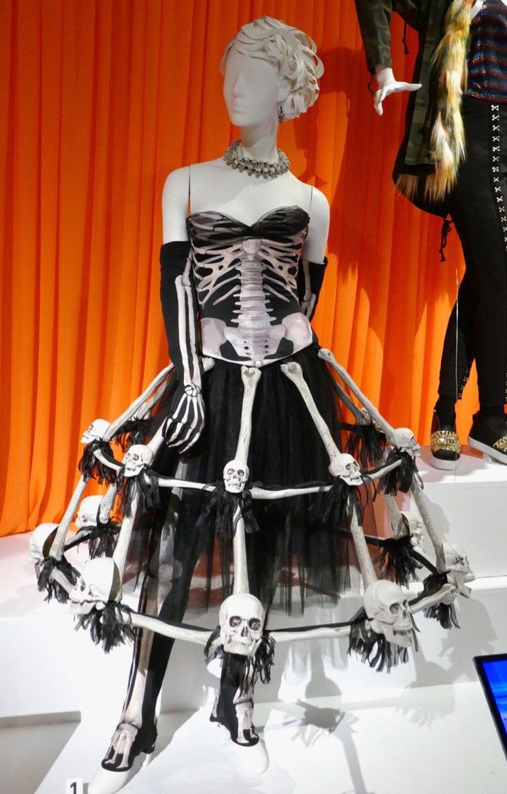 a mannequin dressed in black and white with skeleton decorations