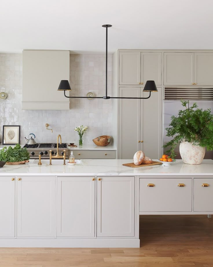 the kitchen is clean and ready to be used for cooking or eating, while also being used as a dining area