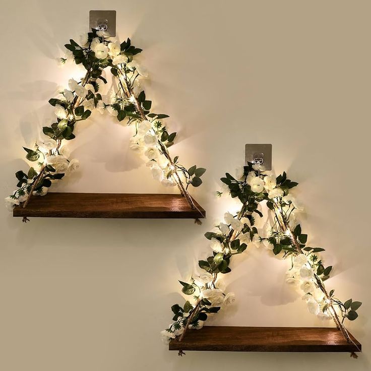 two wooden shelves with lights on them and flowers in the shape of triangle shaped triangles