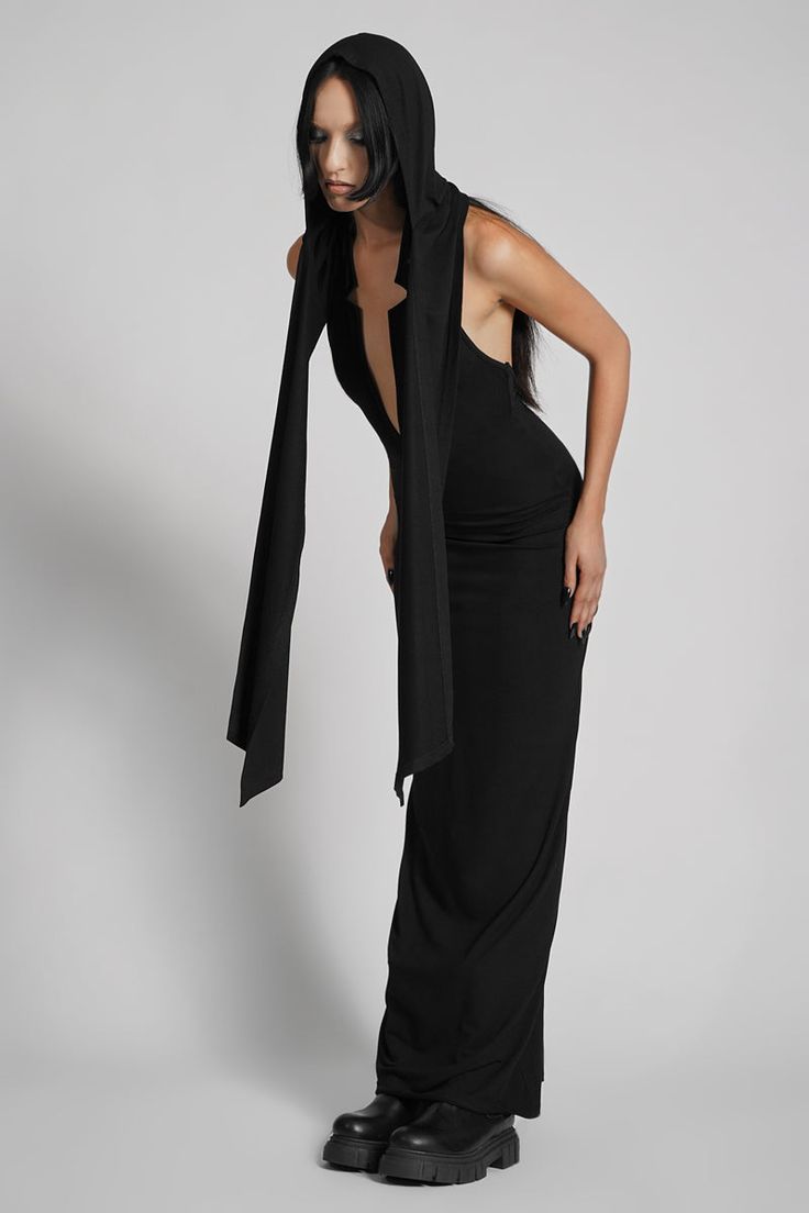 Make them take a second glance. Maxi dress made from luxuriously dense Jersey, featuring an add-on hood that can be draped across the shoulders and over the crown of the head, with plunging halter top neckline. FIT NOTES:Tatianna wears a size Small, 5'9, with a 26" waist.MATERIALS:95% rayon 5% spandexMade in China Hood Dress, Top Neckline, Formal Tops, Low Neckline, Hooded Dress, Steel Grey, The Crown, Halter Top, The Head