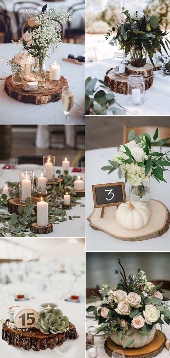 the table is decorated with candles, flowers and succulents