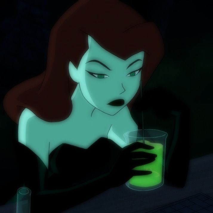 an animated image of a woman holding a glass with green liquid in it and looking at the camera