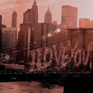 an old photo of the brooklyn bridge in new york city, with skyscrapers behind it