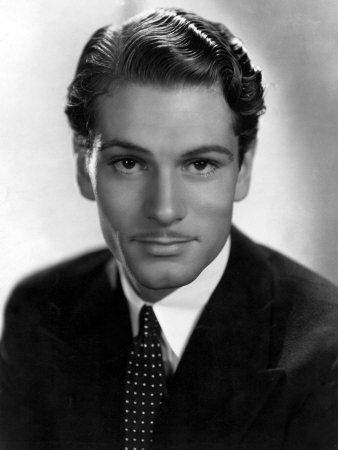 an old black and white photo of a man in a suit