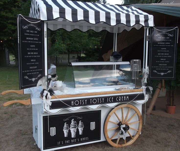 an old fashioned ice cream cart on the ground