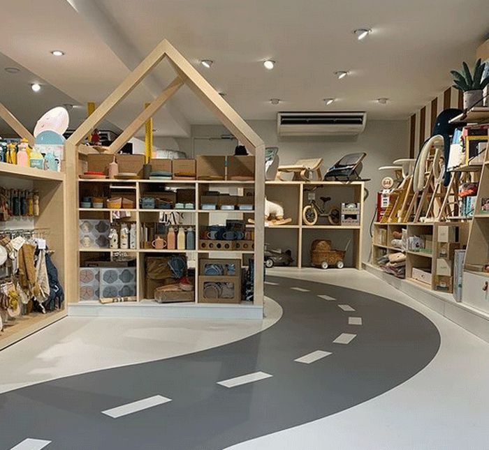 the inside of a store with shelves filled with items