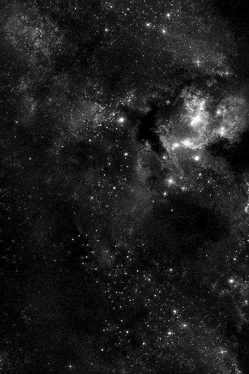 black and white photograph of the night sky with many stars in it, as seen from space