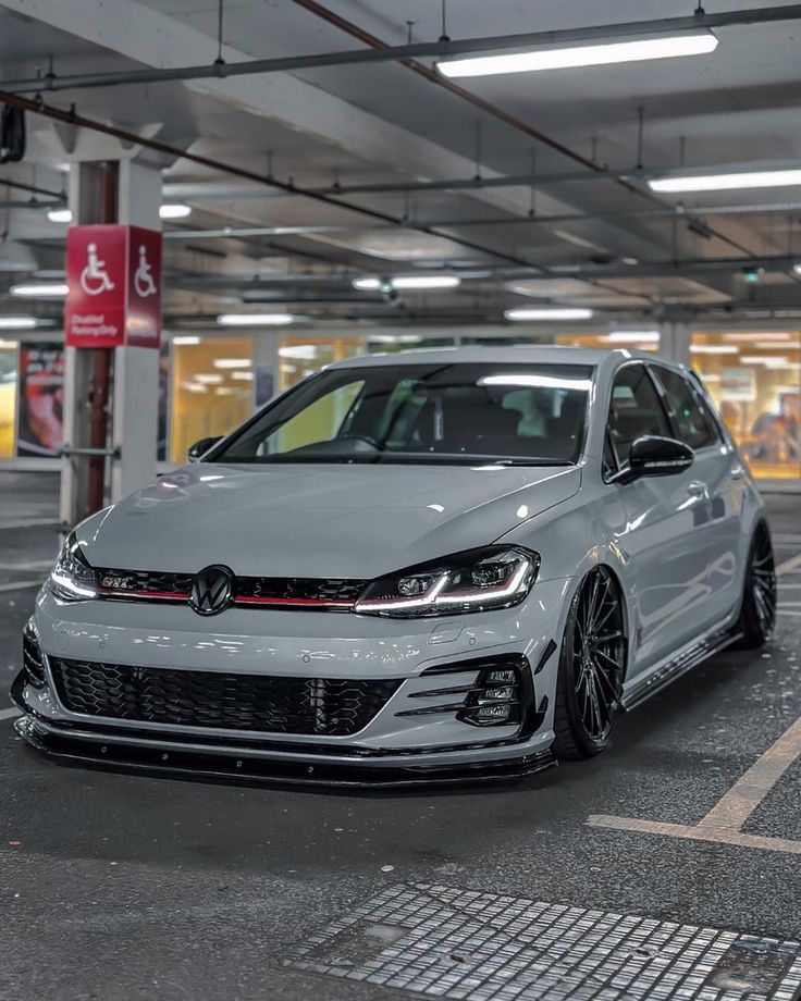 a white car parked in a parking garage