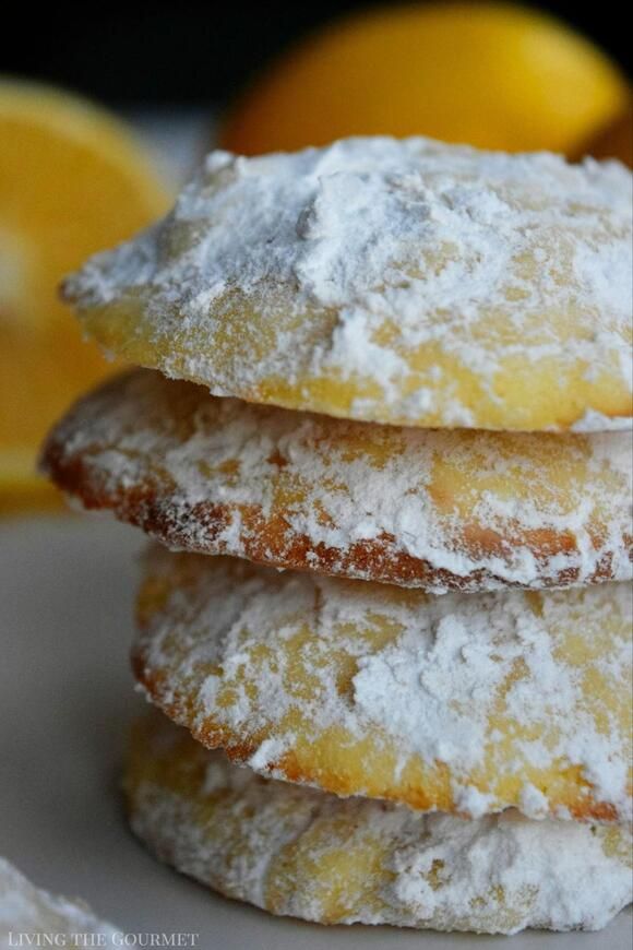 three lemon filled donuts stacked on top of each other with powdered sugar toppings