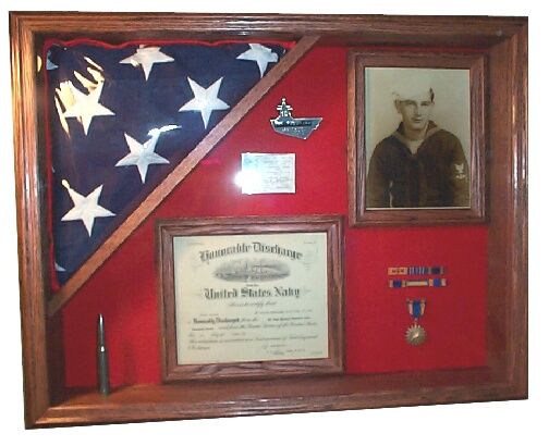 an american flag and other items are on display in a shadow box that is made out of wood