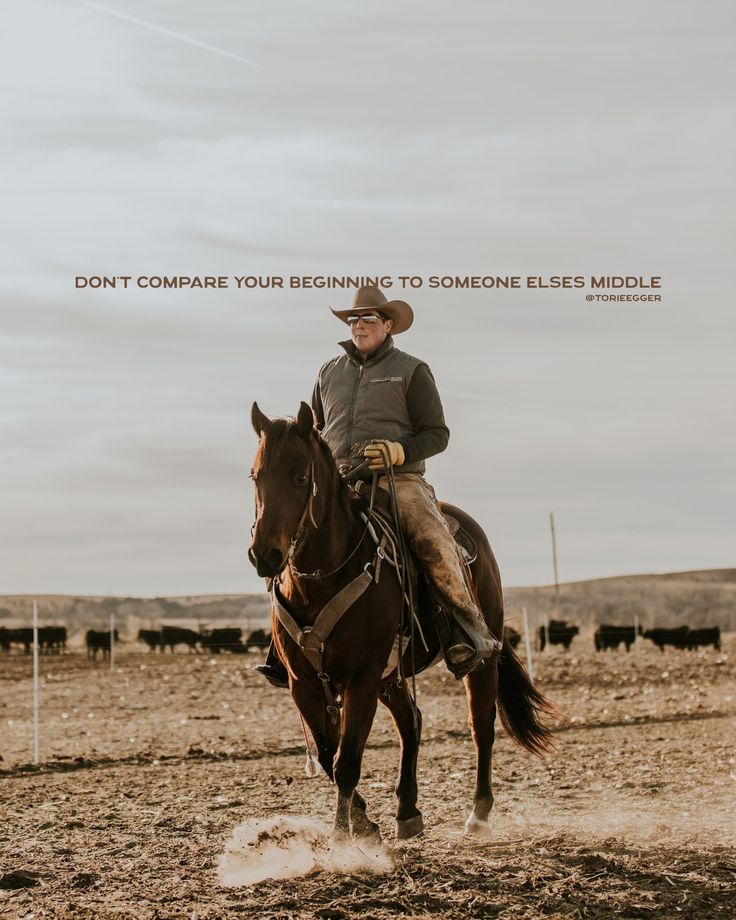 a man riding on the back of a brown horse