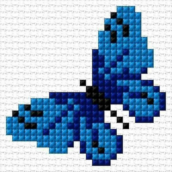 a cross stitch pattern with blue and black squares in the shape of an abstract butterfly