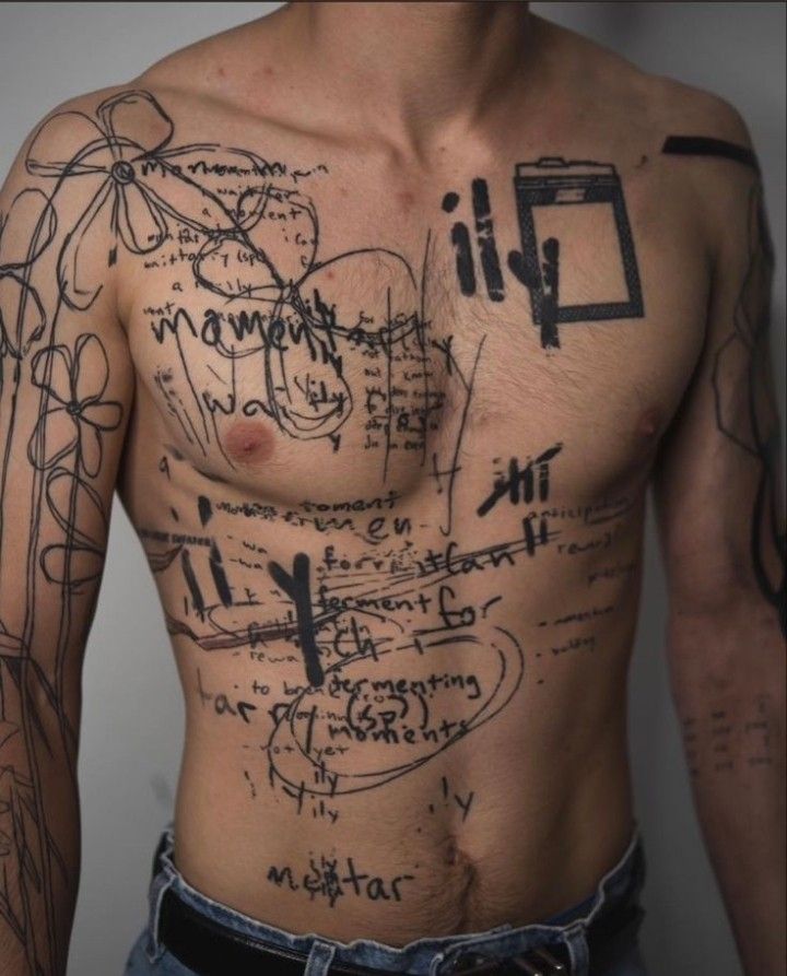 a man with lots of writing on his chest