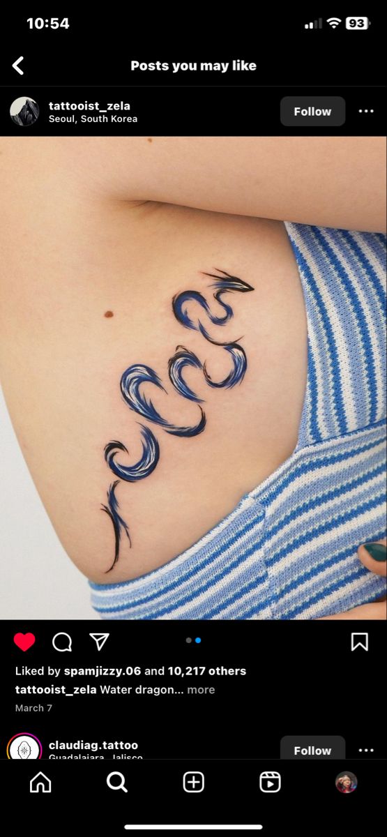 a woman's stomach with the word love tattooed on her chest and an image of two