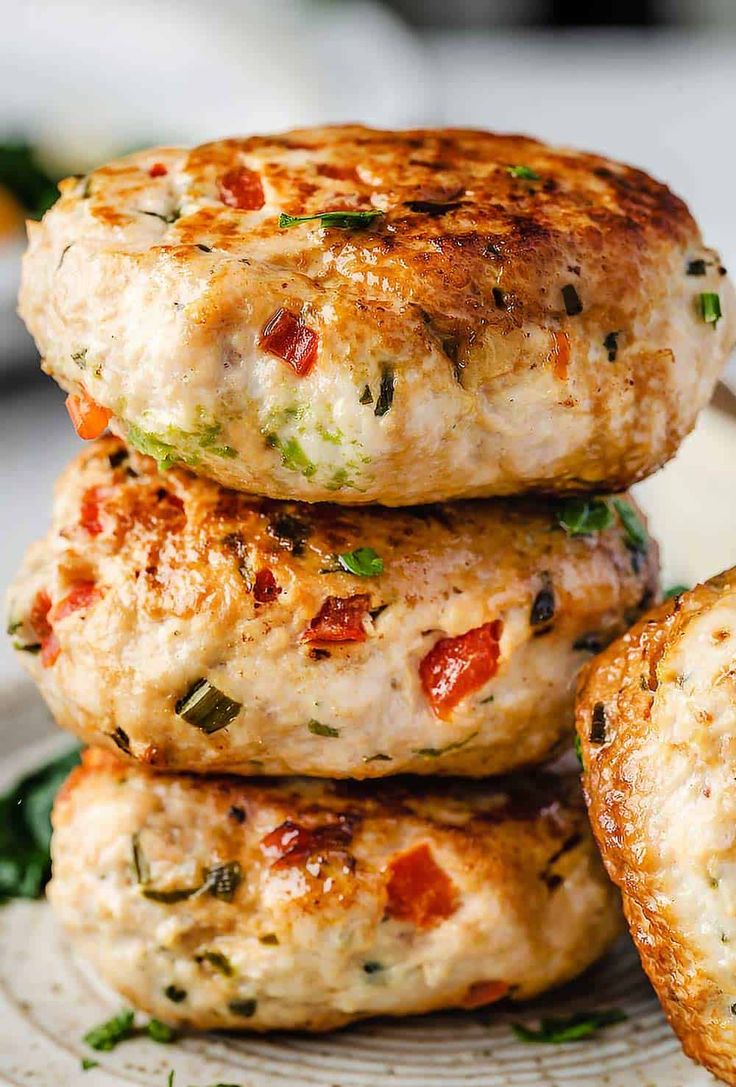 three crab cakes stacked on top of each other