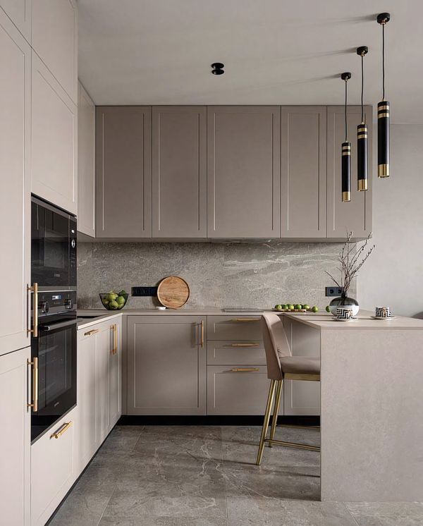 a modern kitchen with marble counter tops and stainless steel appliances