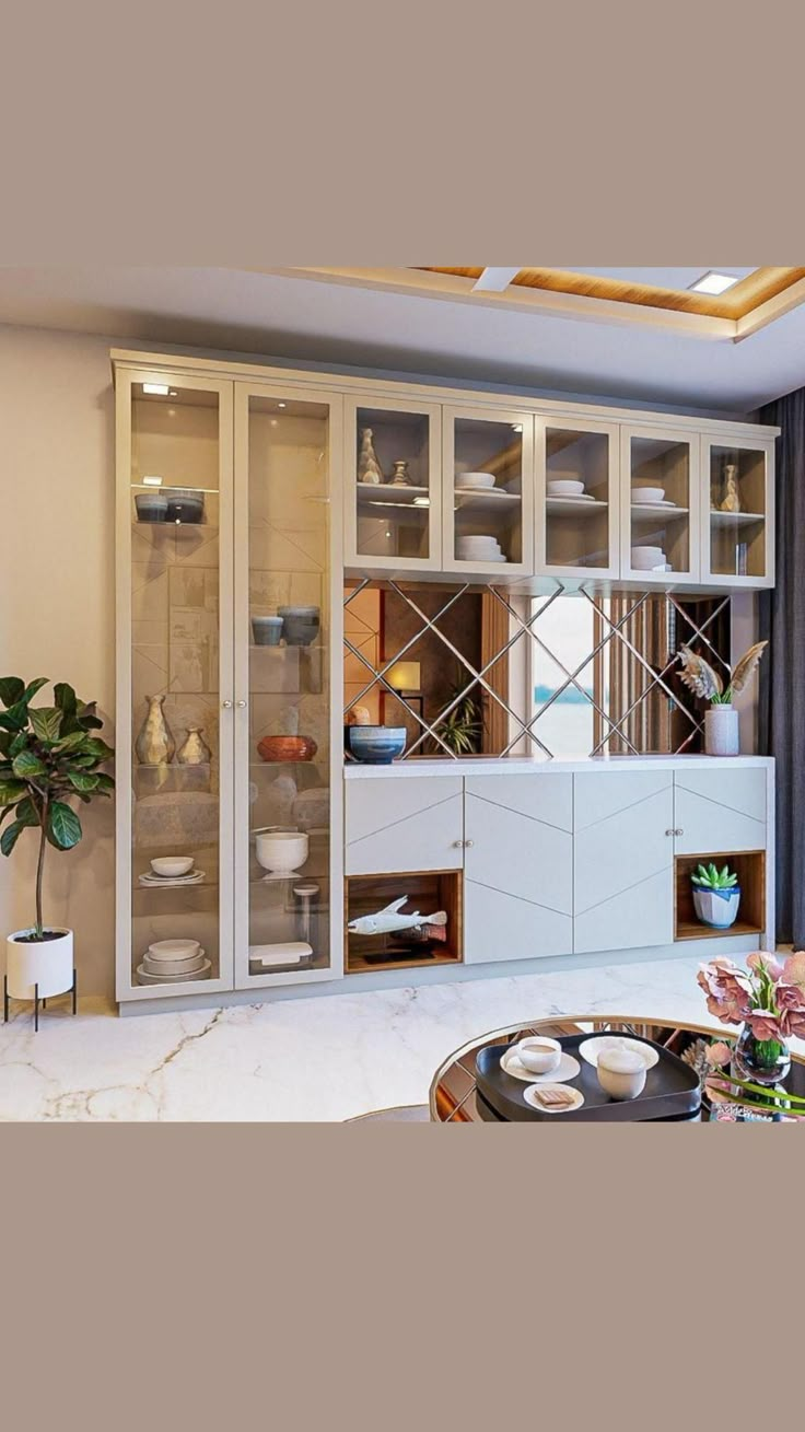 a living room filled with lots of furniture next to a large glass door wall unit